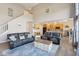 Open concept living room with a large blue rug, two sofas, and a view of the kitchen at 7370 Chestnut Hills Blvd, Indianapolis, IN 46278