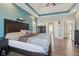 Bright main bedroom with a tray ceiling, light blue accent wall, and ensuite bathroom access at 7370 Chestnut Hills Blvd, Indianapolis, IN 46278