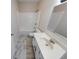 This bathroom features white fixtures, a tub, and a vanity at 7621 Orchard Village Dr, Indianapolis, IN 46217