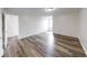 Large bedroom with wood-look flooring and ample natural light at 7621 Orchard Village Dr, Indianapolis, IN 46217