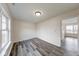 Cozy bedroom with wood-look flooring, natural light, and closet space at 7621 Orchard Village Dr, Indianapolis, IN 46217