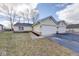 Charming home with two-car garage and well-maintained lawn in a desirable neighborhood at 7621 Orchard Village Dr, Indianapolis, IN 46217