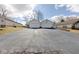 Attached townhome featuring two garages and asphalt driveway at 7621 Orchard Village Dr, Indianapolis, IN 46217