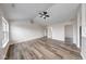 Spacious living room with vaulted ceiling, wood-look floors, and ample natural light at 7621 Orchard Village Dr, Indianapolis, IN 46217
