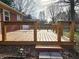 Wooden back deck featuring wood railings perfect for outdoor relaxation and entertaining at 8143 Filly Ln, Plainfield, IN 46168
