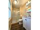 Bathroom featuring glass enclosed shower, new vanity, and hardwood floors at 8143 Filly Ln, Plainfield, IN 46168