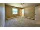 Bedroom with neutral carpet, large window, ceiling fan, and closet at 8143 Filly Ln, Plainfield, IN 46168