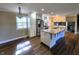 Spacious kitchen with stainless steel appliances, a granite island, recessed lighting and hardwood floors at 8143 Filly Ln, Plainfield, IN 46168
