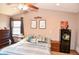Bedroom with ceiling fan, carpet flooring, dresser, and tasteful decor elements at 8513 Shelbyville Rd, Indianapolis, IN 46259