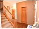 Foyer area with staircase, wood flooring, and neutral wall colors at 8513 Shelbyville Rd, Indianapolis, IN 46259