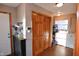 Well-organized laundry room boasts wood floors, washer, dryer, and ample storage at 8513 Shelbyville Rd, Indianapolis, IN 46259
