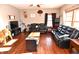 Spacious living room with comfortable seating, wood floors, and natural light at 8513 Shelbyville Rd, Indianapolis, IN 46259