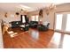 Spacious living room with ample seating, wood floors, and natural light at 8513 Shelbyville Rd, Indianapolis, IN 46259