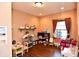 A playroom featuring a window, shelves with toys and an area for activities at 8513 Shelbyville Rd, Indianapolis, IN 46259
