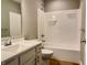 Pristine bathroom featuring a white vanity and sink, alongside a bathtub and shower combination at 922 N Oakland Ave, Indianapolis, IN 46201