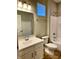 Modern bathroom with white vanity, sink, and a shower-tub combo with modern fixtures at 922 N Oakland Ave, Indianapolis, IN 46201