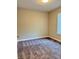 Bedroom featuring neutral walls, carpet, a window, and minimalist design at 922 N Oakland Ave, Indianapolis, IN 46201