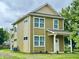 Charming two-story home featuring a clean exterior and a well-maintained lawn at 922 N Oakland Ave, Indianapolis, IN 46201