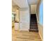 Open interior view showcasing stairs and kitchen cabinets, creating a sense of spaciousness at 922 N Oakland Ave, Indianapolis, IN 46201