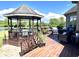 A serene back deck with gazebo, comfortable seating, and a tranquil view of the surrounding landscape at 9615 N County Road 150 E Rd, Pittsboro, IN 46167