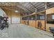 Spacious horse barn with multiple stalls, storage, and ample room for equestrian activities at 9615 N County Road 150 E Rd, Pittsboro, IN 46167