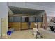 Indoor barn with wooden horse stalls and overhead lighting at 9615 N County Road 150 E Rd, Pittsboro, IN 46167