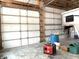 Barn interior featuring multiple bays for parking vehicles or equipment at 9615 N County Road 150 E Rd, Pittsboro, IN 46167