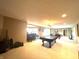 Spacious basement featuring a pool table, a bar area with seating, and neutral carpeting at 9615 N County Road 150 E Rd, Pittsboro, IN 46167