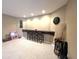 Finished basement with a bar area, bar seating, recessed lighting and a mounted wall clock at 9615 N County Road 150 E Rd, Pittsboro, IN 46167