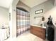 Bathroom featuring a tiled shower, vintage chest and neutral walls at 9615 N County Road 150 E Rd, Pittsboro, IN 46167