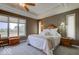 This is a bedroom suite featuring a large window, neutral colors, and a trey ceiling at 9615 N County Road 150 E Rd, Pittsboro, IN 46167