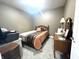 This cozy bedroom has carpeted floors, a ceiling fan and a dresser at 9615 N County Road 150 E Rd, Pittsboro, IN 46167