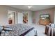 Spacious bedroom with soft carpet, a large tv, bright windows, and en-suite bathroom at 9615 N County Road 150 E Rd, Pittsboro, IN 46167