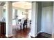 An open dining room is pictured with white columns and an archway above hardwood floors at 9615 N County Road 150 E Rd, Pittsboro, IN 46167