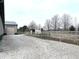The driveway leads to additional buildings and outdoor spaces, showcasing the property's layout at 9615 N County Road 150 E Rd, Pittsboro, IN 46167
