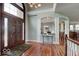 Inviting foyer features a leaded-glass front door, hardwood floors, and decorative trim at 9615 N County Road 150 E Rd, Pittsboro, IN 46167