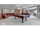 A finished basement featuring a lounge area, a pool table, and a bar at 9615 N County Road 150 E Rd, Pittsboro, IN 46167