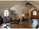 This large gym is on the top floor with wood-paneled walls, wood floors, and exercise equipment at 9615 N County Road 150 E Rd, Pittsboro, IN 46167