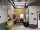 Inside, a well-equipped workspace with tools and a rustic hay bale offers practicality at 9615 N County Road 150 E Rd, Pittsboro, IN 46167