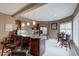 Open kitchen with wood cabinets, stainless appliances, marble countertops, and seating at the bar at 9615 N County Road 150 E Rd, Pittsboro, IN 46167