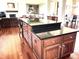 A large kitchen island features a dark countertop, wood cabinets, drawers and visible outlets at 9615 N County Road 150 E Rd, Pittsboro, IN 46167