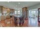 Spacious kitchen with granite countertops, a large island, and access to the sunroom at 9615 N County Road 150 E Rd, Pittsboro, IN 46167