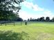 Spacious land with wooden fencing and lush greenery, perfect for outdoor activities at 9615 N County Road 150 E Rd, Pittsboro, IN 46167