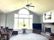 Cozy living room with a fireplace, a large window, and comfortable seating perfect for relaxation at 9615 N County Road 150 E Rd, Pittsboro, IN 46167