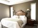 Comfortable main bedroom featuring a large bed, decorative headboard, and bedside tables with lamps at 9615 N County Road 150 E Rd, Pittsboro, IN 46167