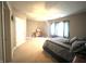 This main bedroom features a ceiling fan, neutral walls, and bright windows at 9615 N County Road 150 E Rd, Pittsboro, IN 46167