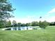 Scenic pond with lush greenery and a bright blue sky, creating a peaceful and serene setting at 9615 N County Road 150 E Rd, Pittsboro, IN 46167