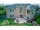 Beautiful home featuring an outdoor seating area, fire pit, and well-maintained landscaping at 9615 N County Road 150 E Rd, Pittsboro, IN 46167