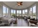Bright sunroom with vaulted ceilings, many windows, and peaceful outdoor views at 9615 N County Road 150 E Rd, Pittsboro, IN 46167