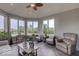 Relax in this light-filled sunroom featuring tile floors and nature views from all the windows at 9615 N County Road 150 E Rd, Pittsboro, IN 46167